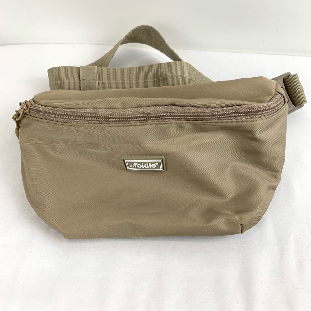 NWOT The Foldie Crossbody Travel Bag Taupe Beige RFID Safe Cut-Proof Strap